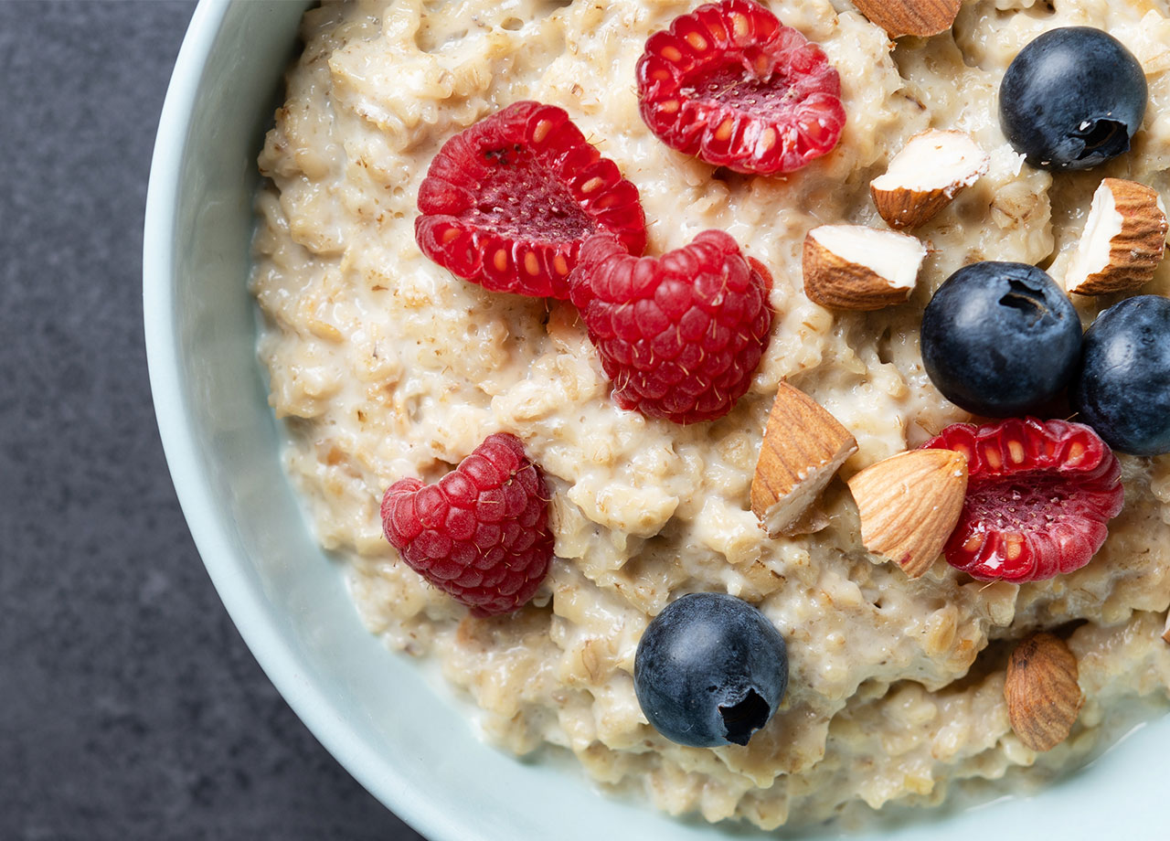 bowl of oatmeal with berries and almonds