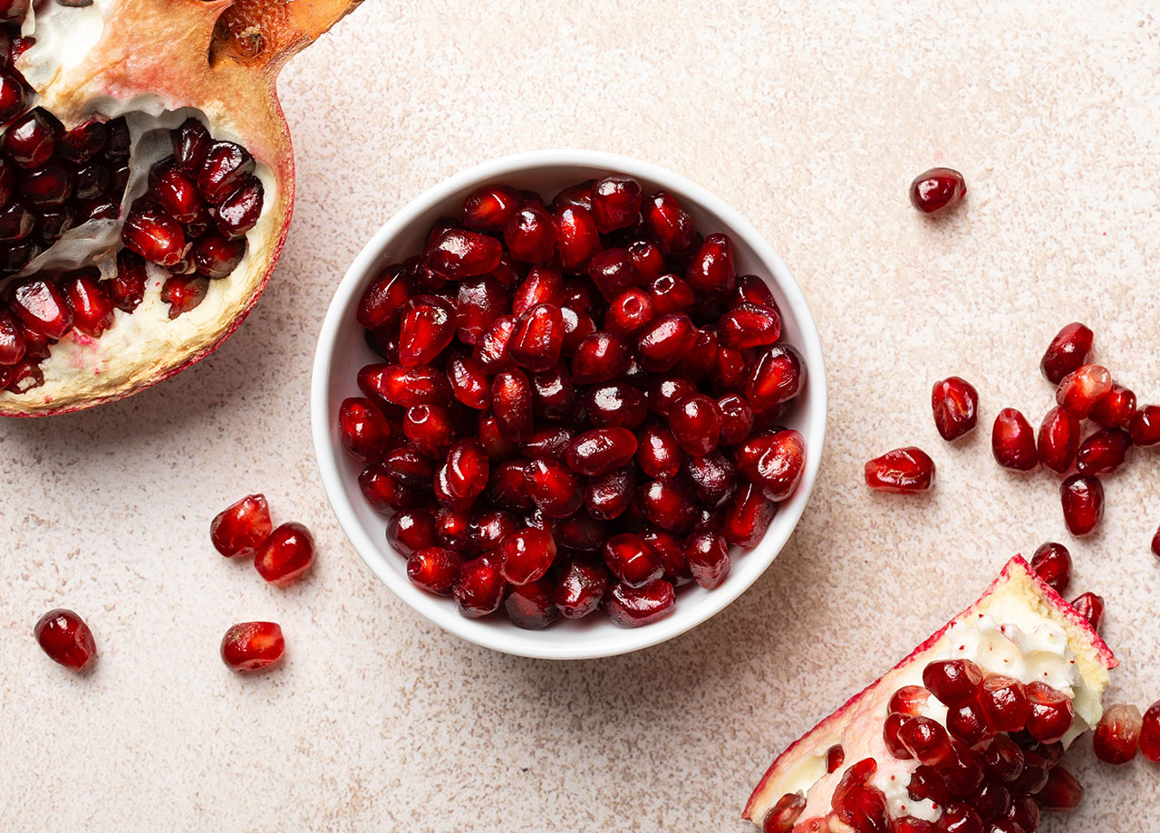 fresh organic juicy pomegranate fruit pieces and seeds