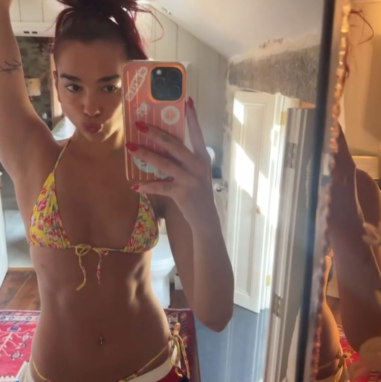 Dua Lipa yellow bikini mirror selfie