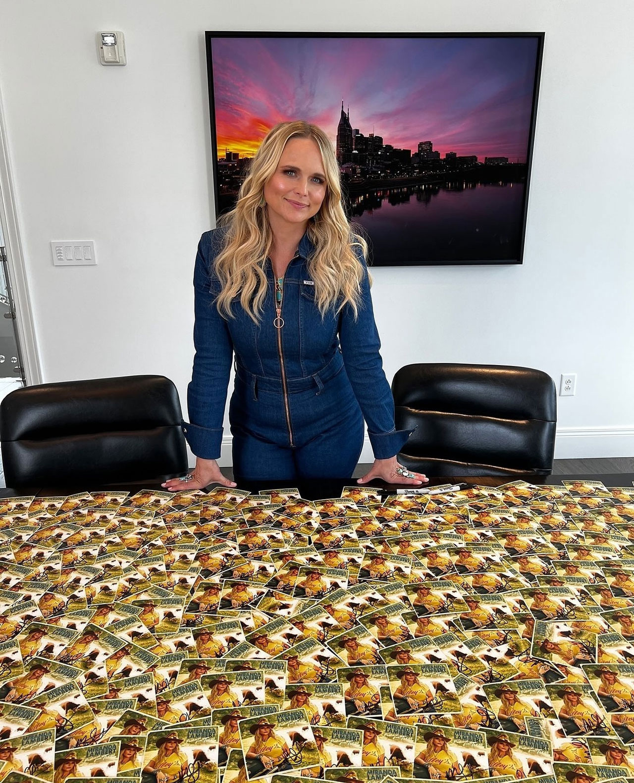 Miranda Lambert in front of signed Postcards from Texas on Instagram