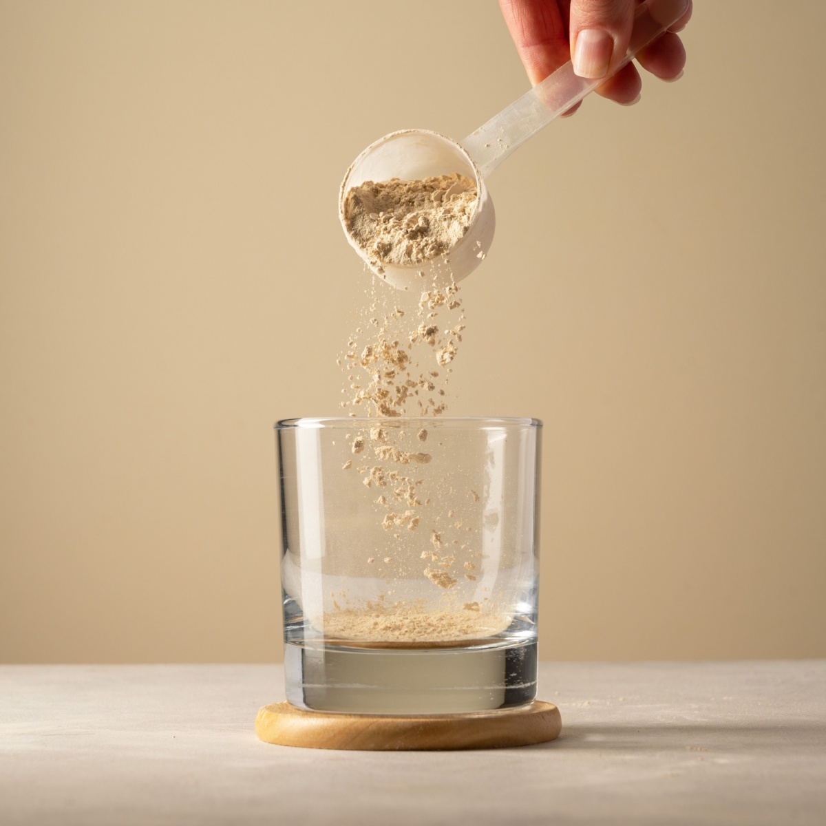 protein powder poured into a glass