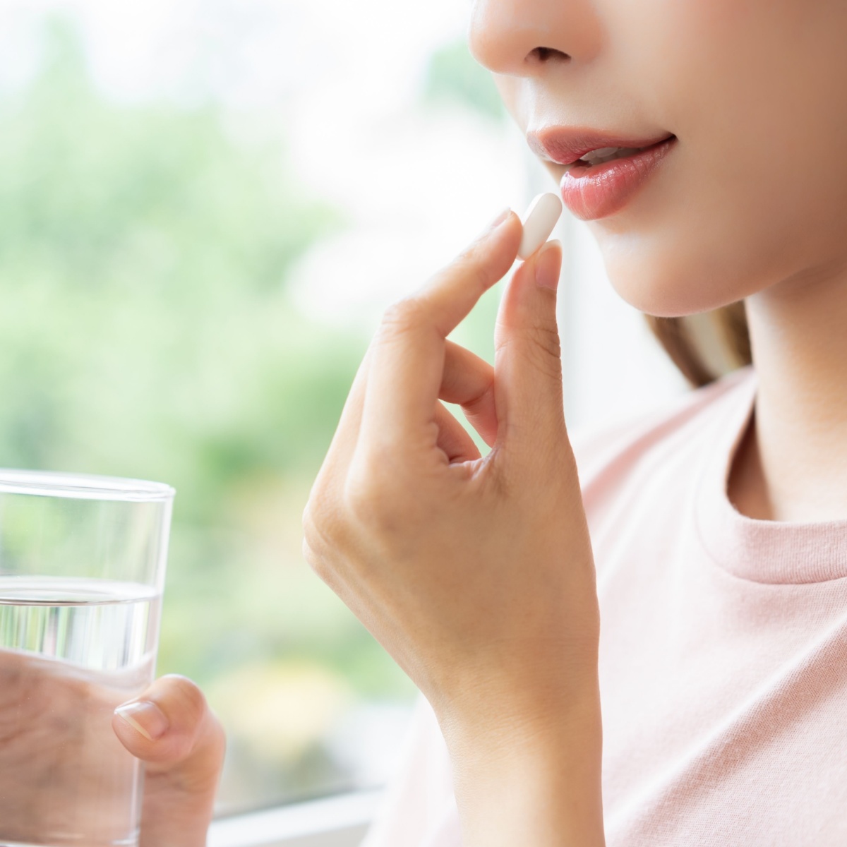 woman taking supplement