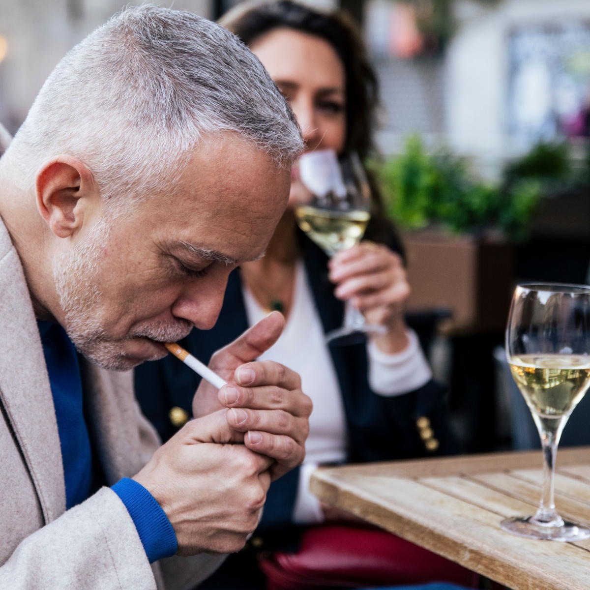 older man smoking cigarette