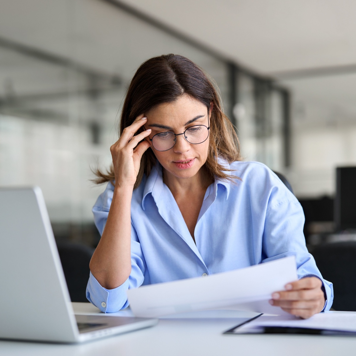 older woman stressing out at work