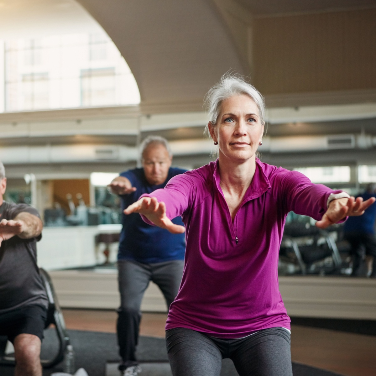 older woman doing squats