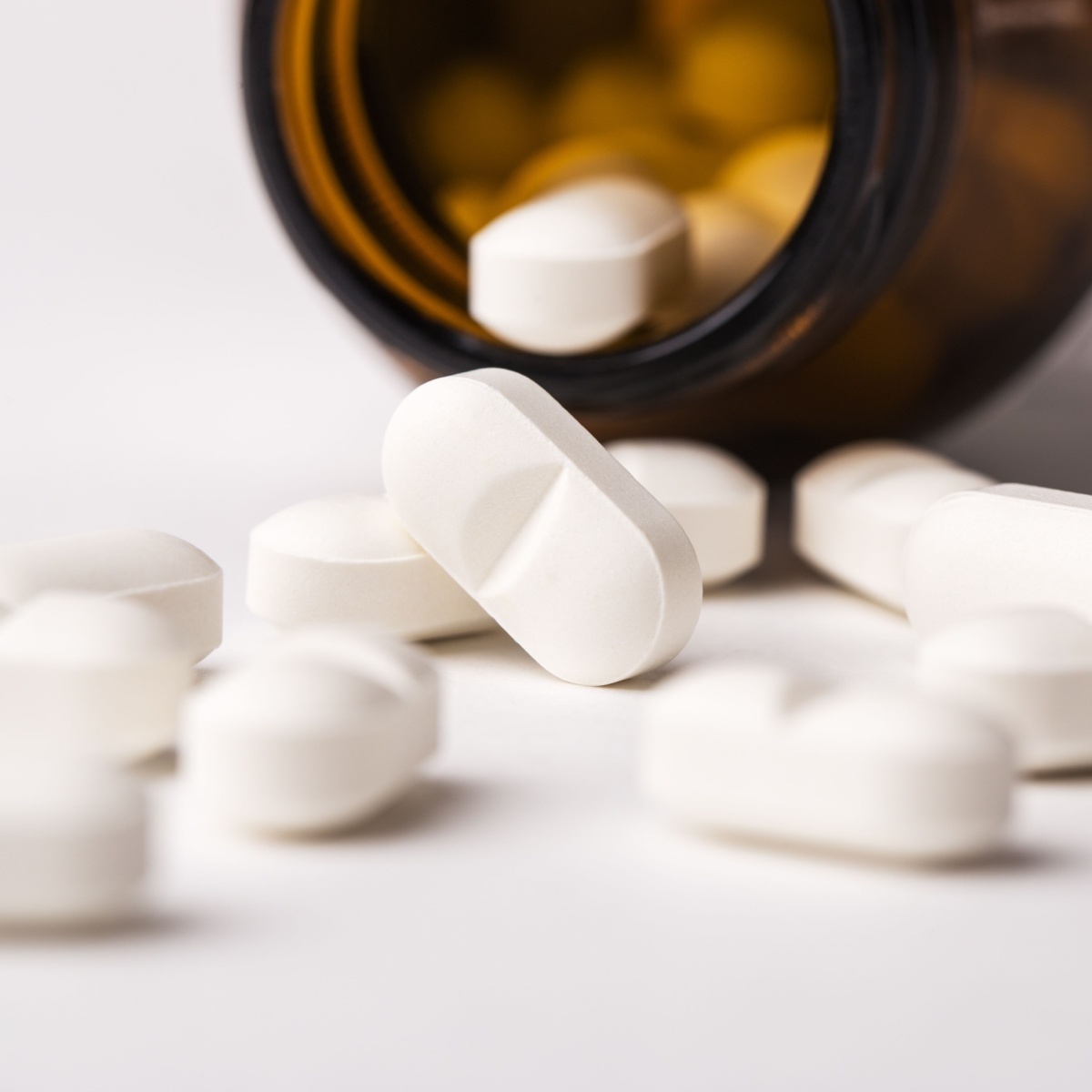 white supplements from a bottle