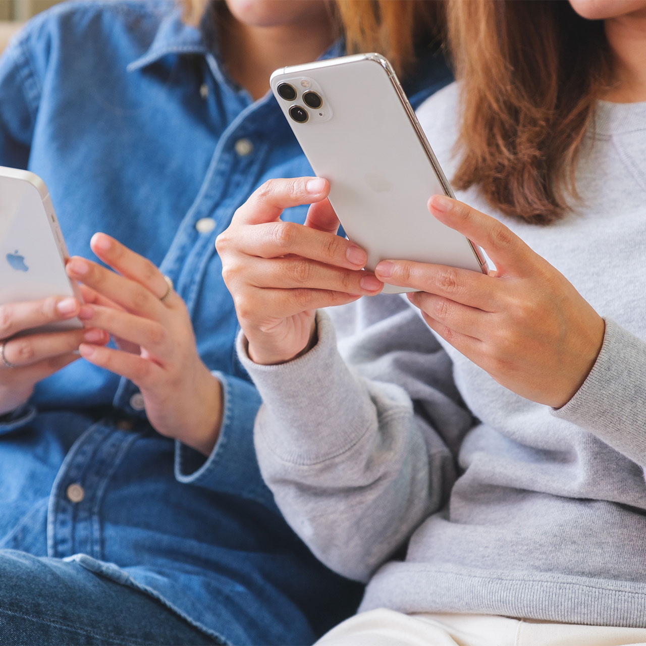 two-friends-looking-phones