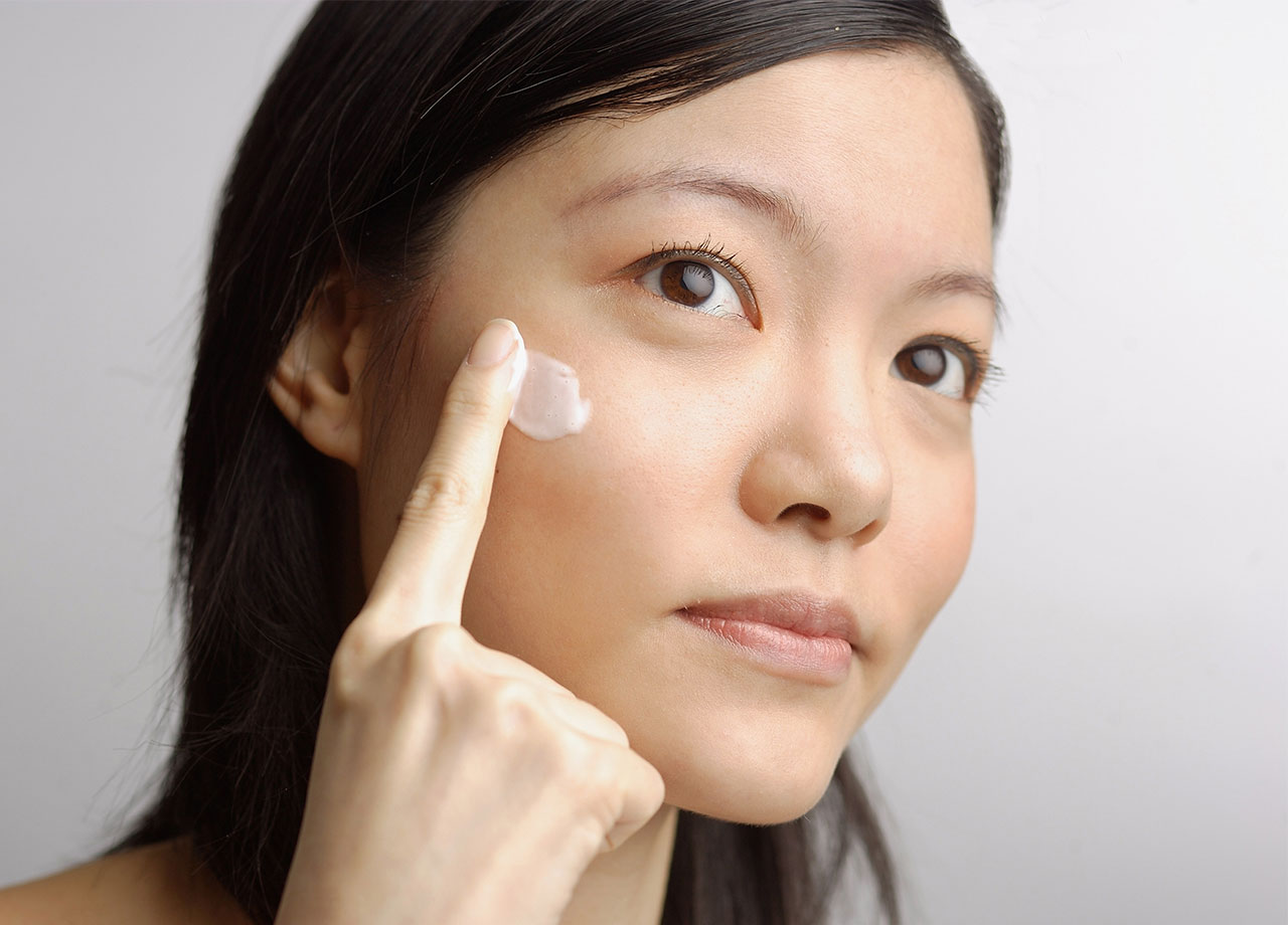 woman-applying-skincare