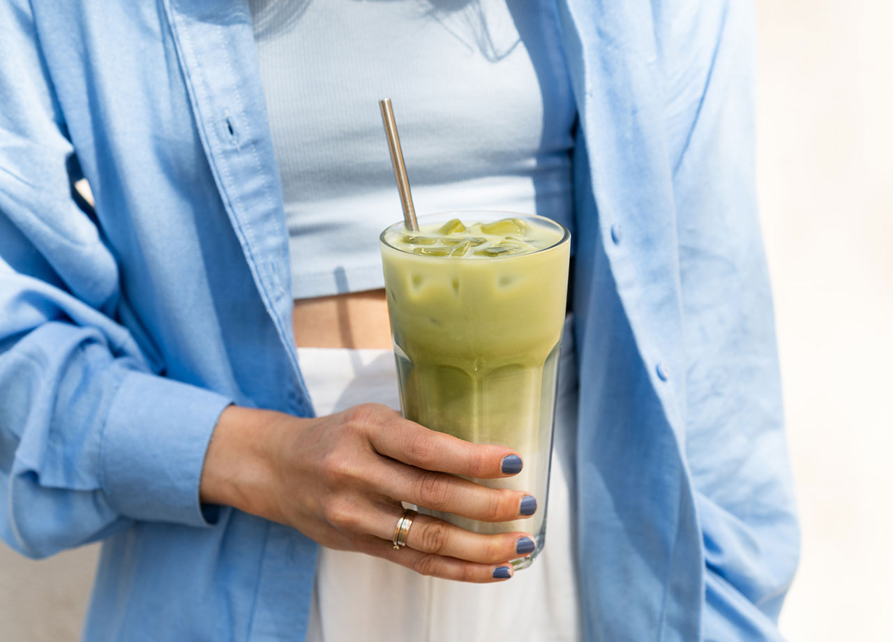 woman-drinking-iced-matcha-latte