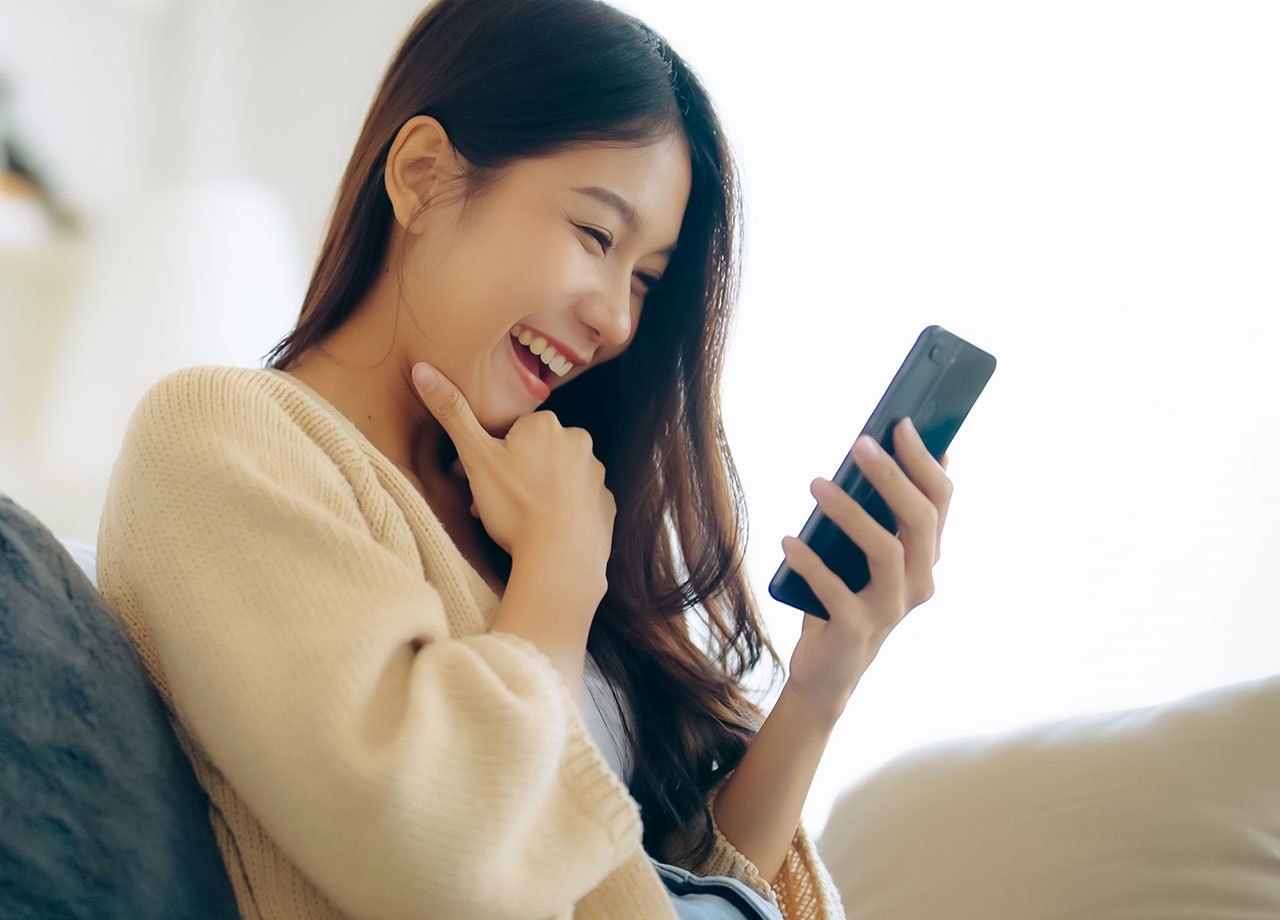 young-woman-enjoying-smartphone