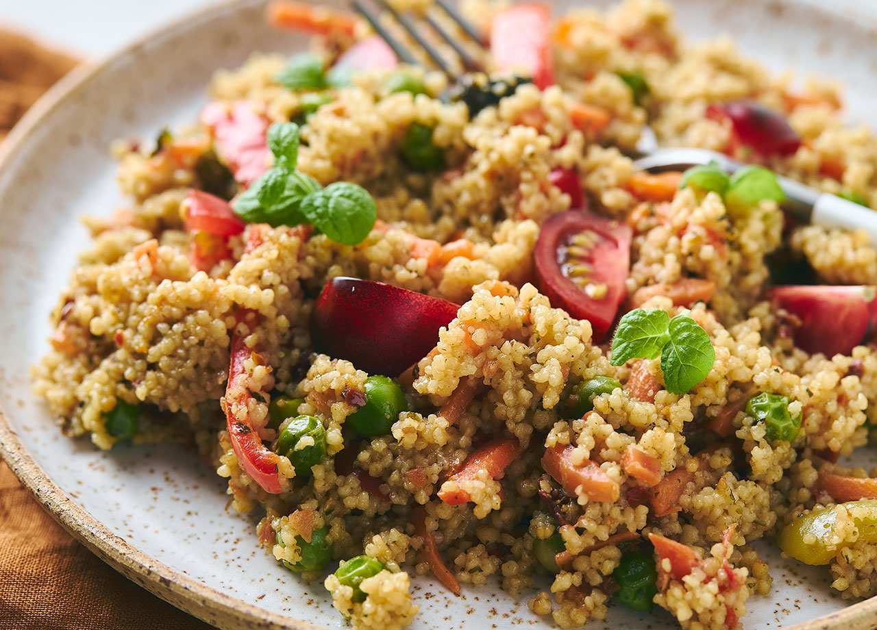 cous cous with vegetables in bowl