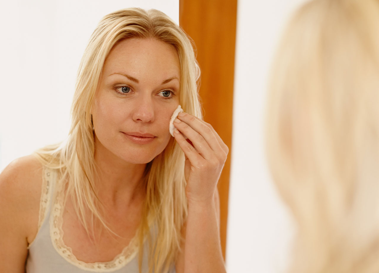 woman using an alcohol based facial toner