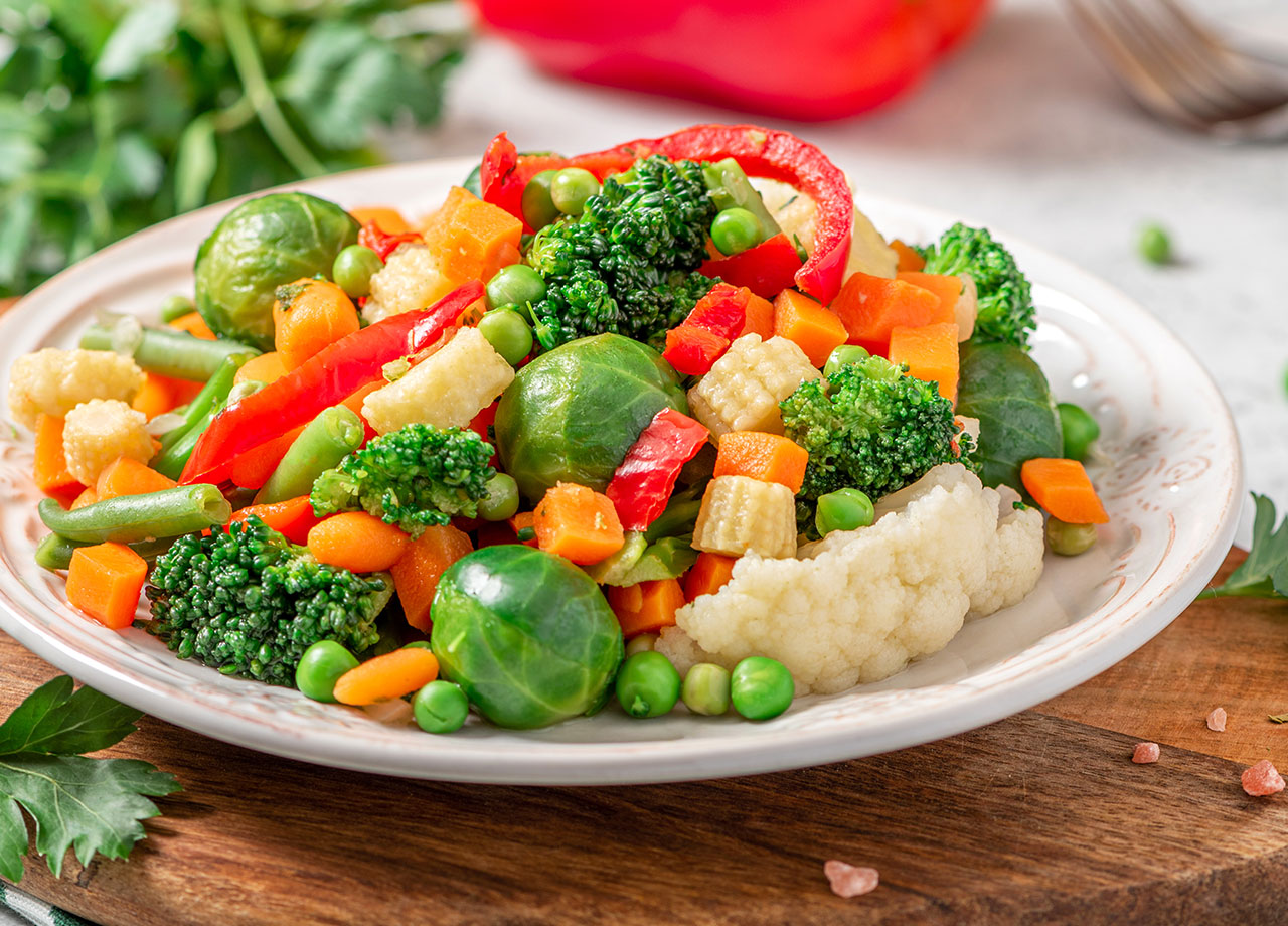 mixed brussels sprouts carrots broccoli peas peppers and baby corn