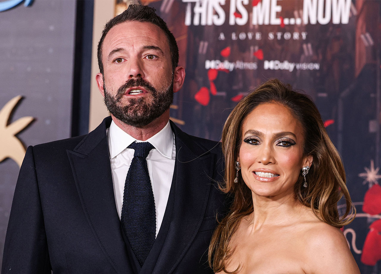 Ben Affleck looking unhappy with Jennifer Lopez on the red carpet