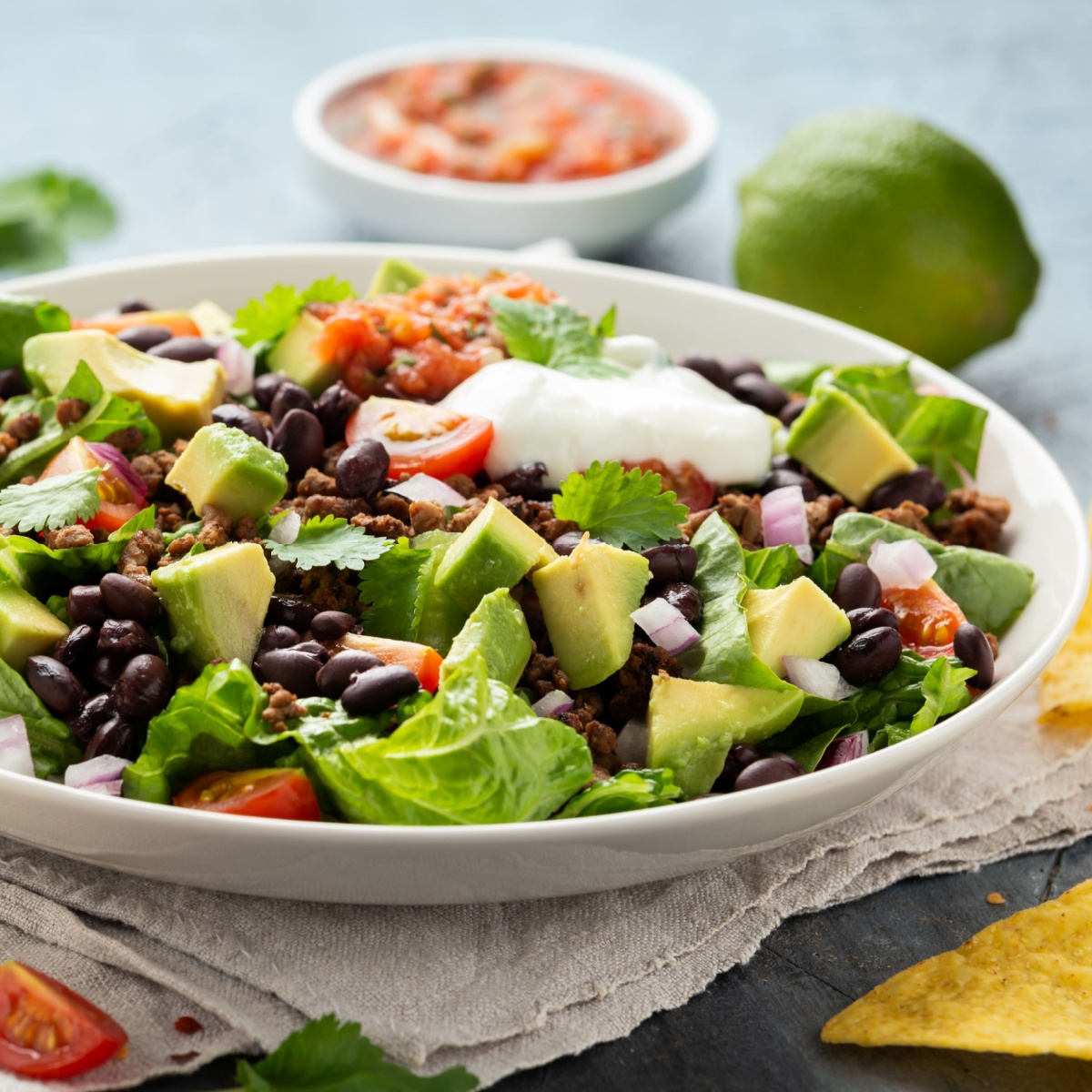 bowl of beans avocados and lettuce