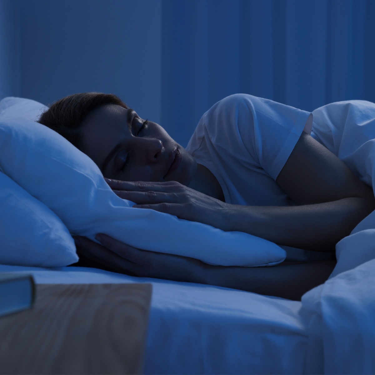 woman sleeping on bed