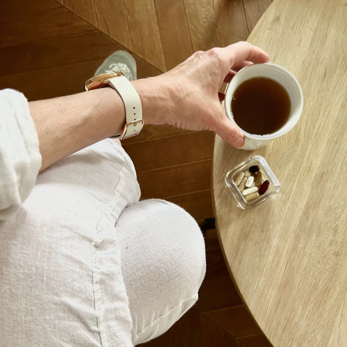 table with coffee cup and supplements