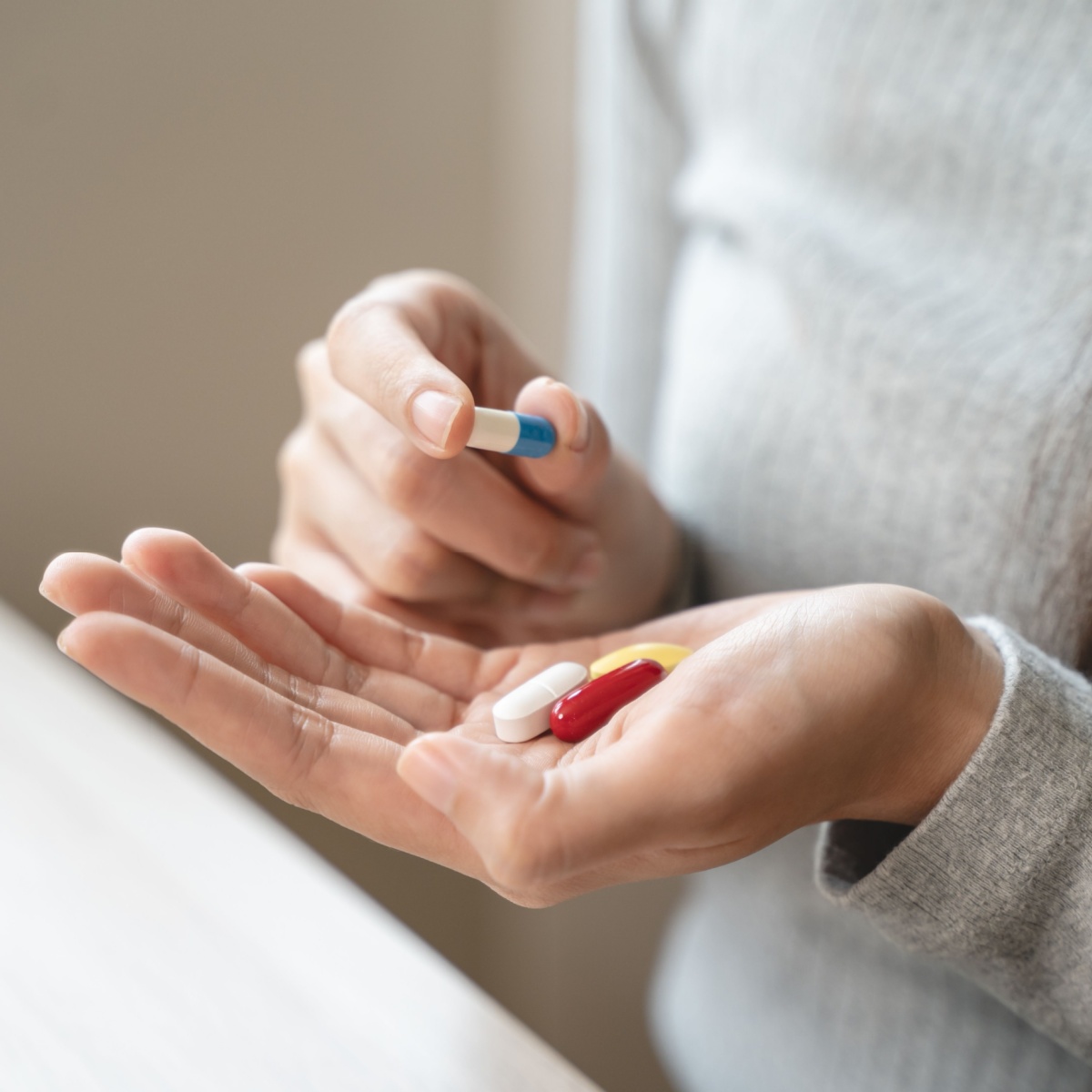 supplements in hand