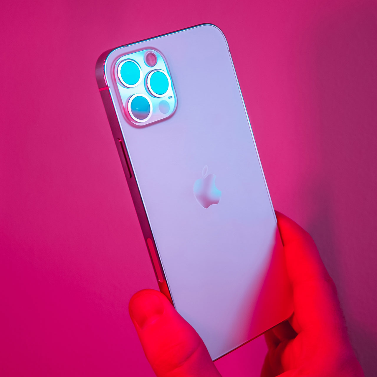 iphone-held-in-pink-lighting