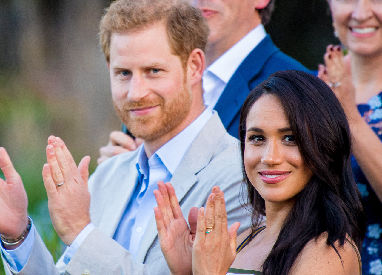 Prince Harry and Meghan Markle clapping