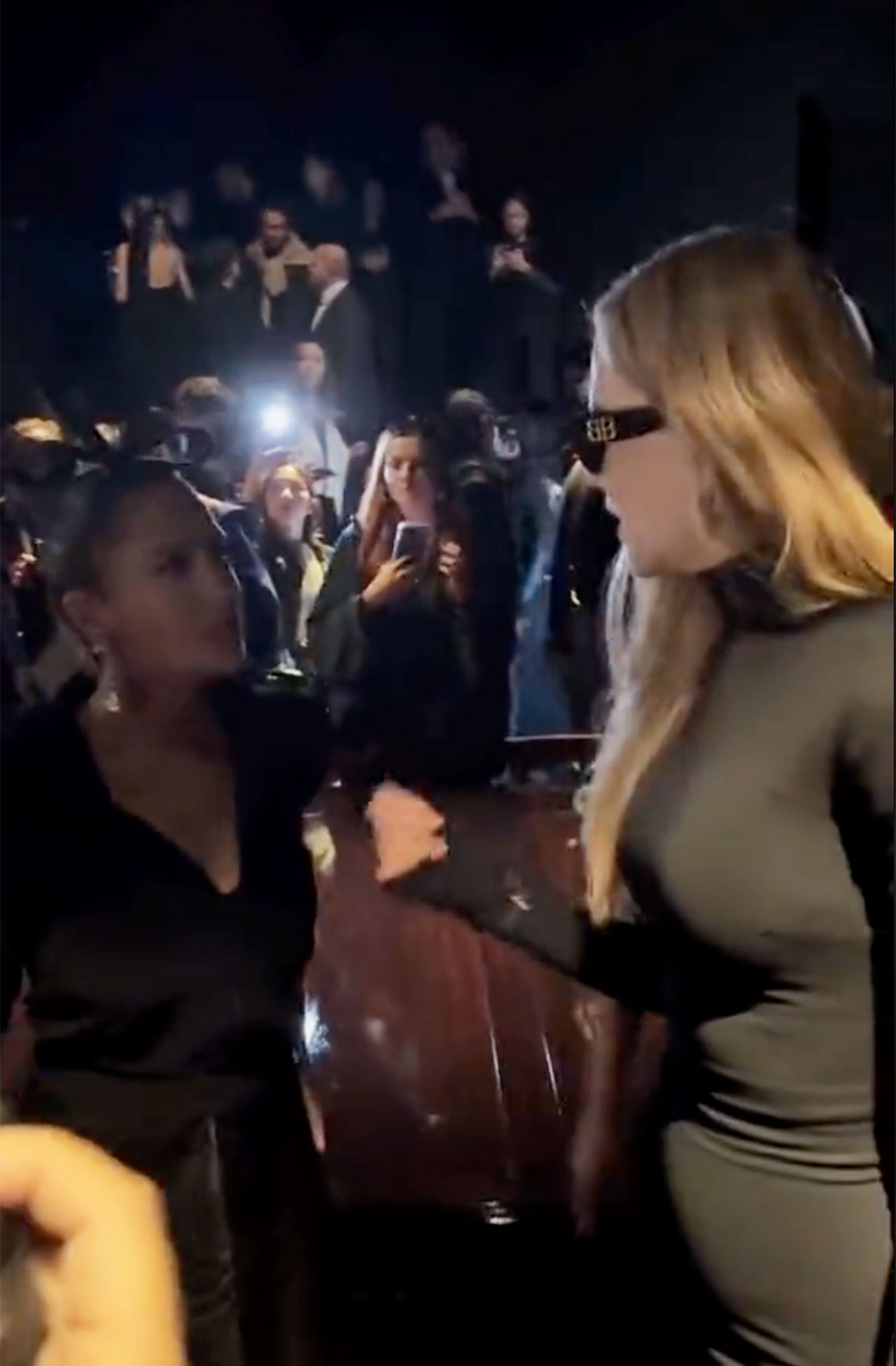 Nicole Kidman and Salma Hayek posing and arguing at Balenciaga show