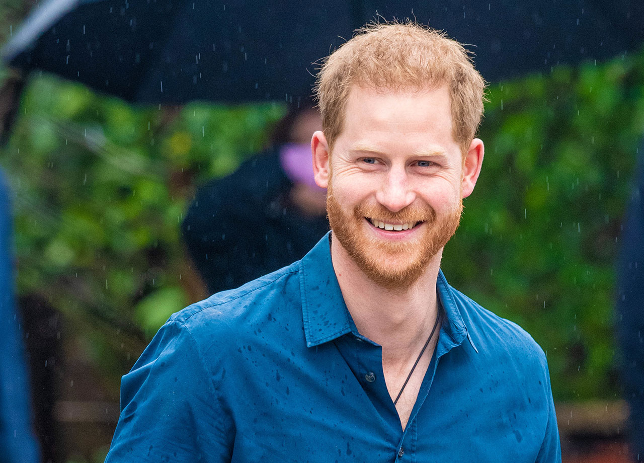 Prince Harry laughing in the rain