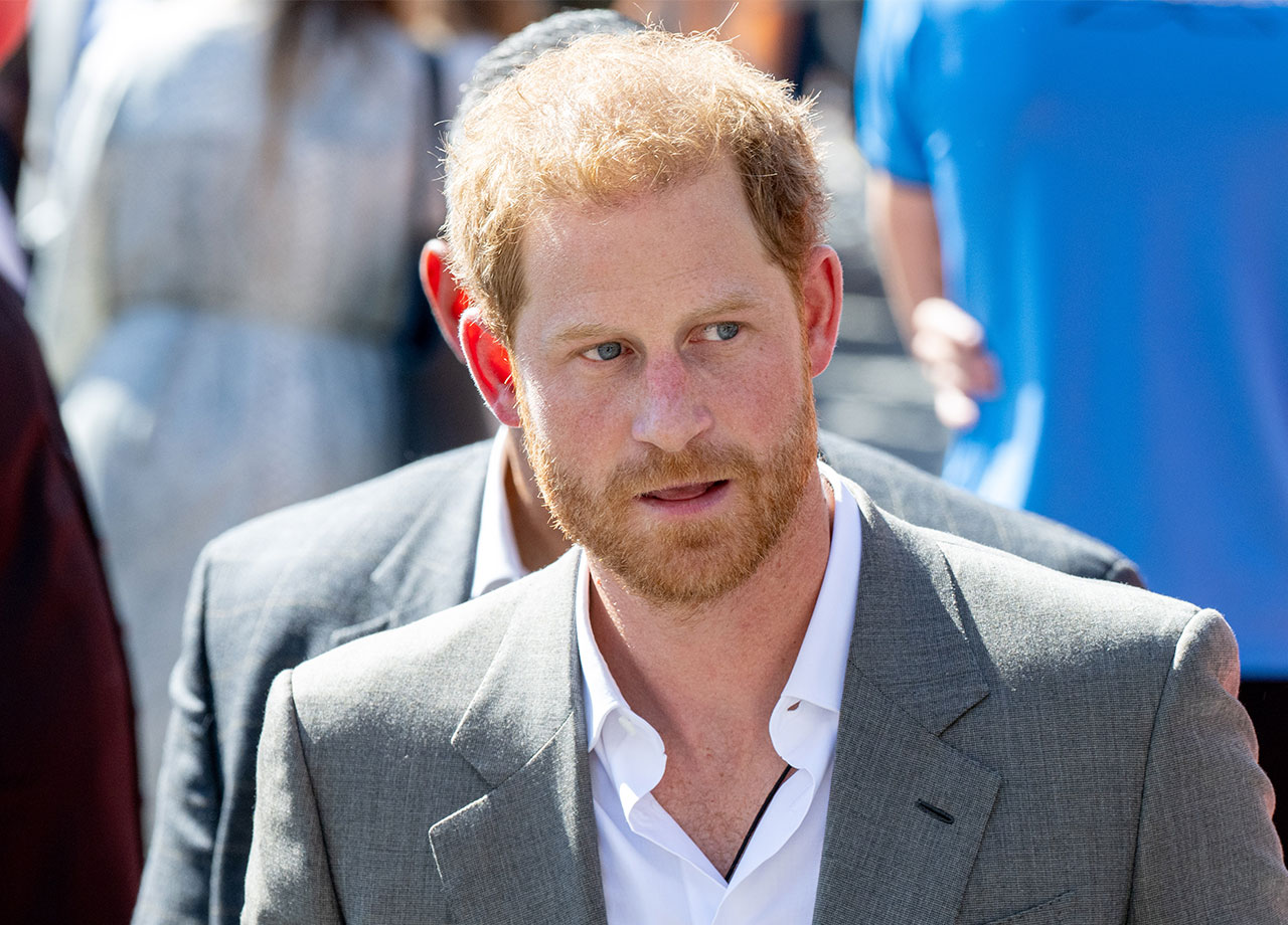 Prince Harry wearing a gray blazer