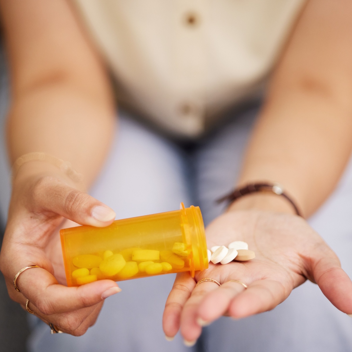 woman with supplements in her hand