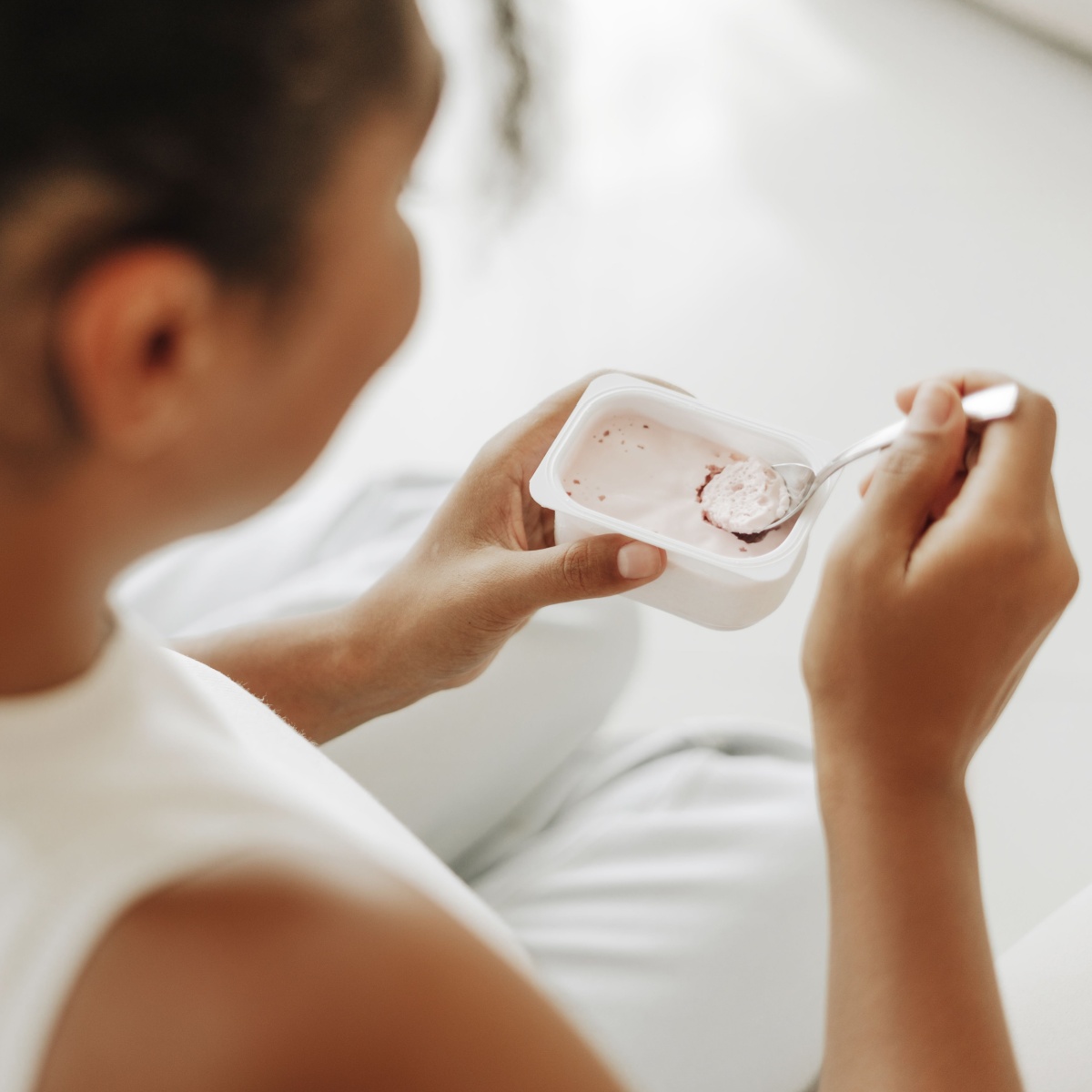 woman eating yogurt