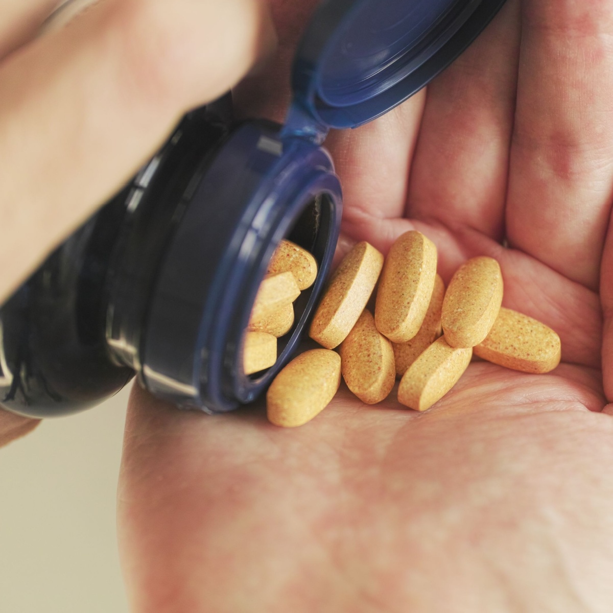 hand full of supplements