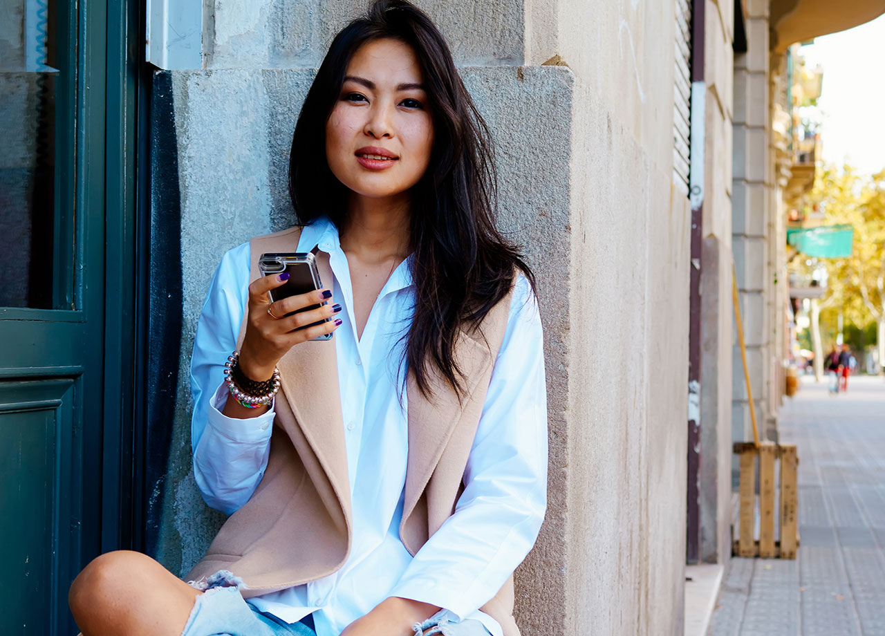 woman holding iphone in hand