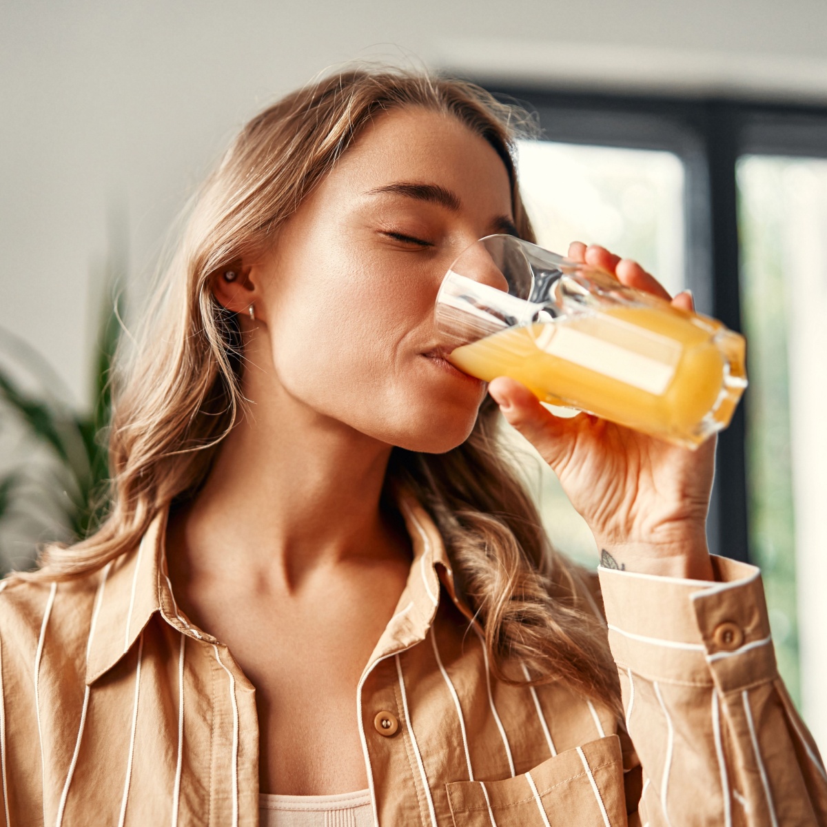 woman drinking fruit juice