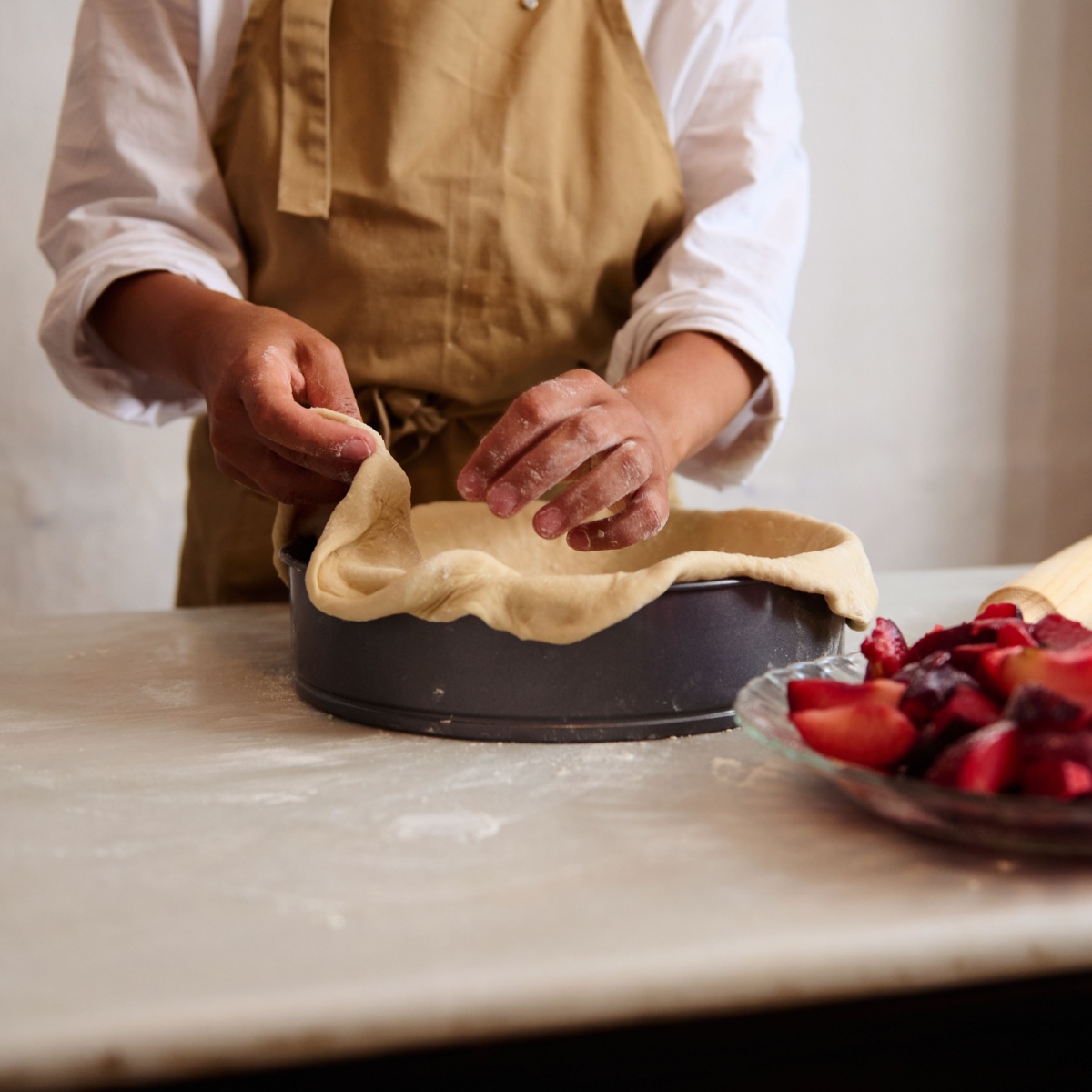 person making pie