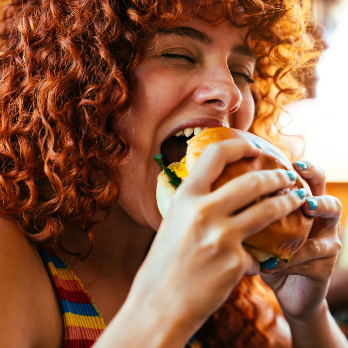 woman eating burger