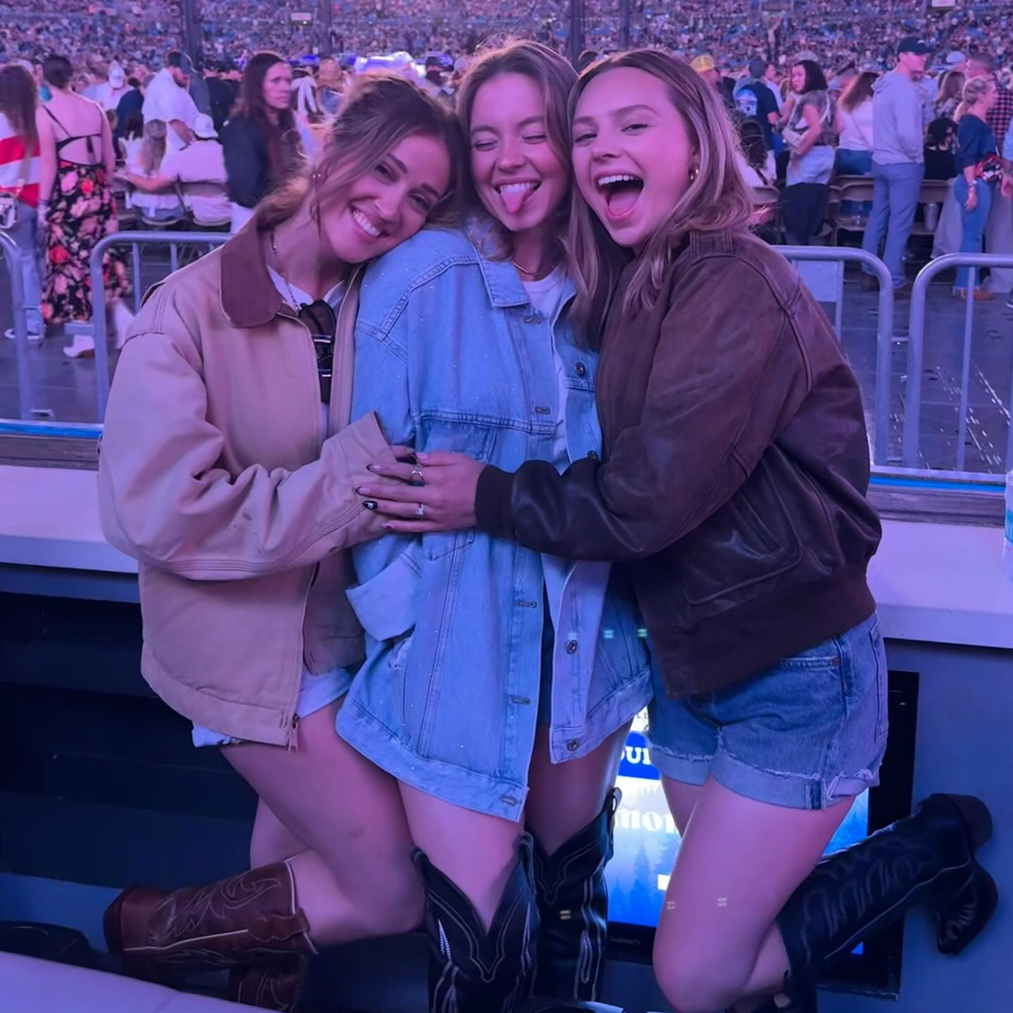 Sydney Sweeney oversized denim jacket cowboy boots Luke Combs concert with friends