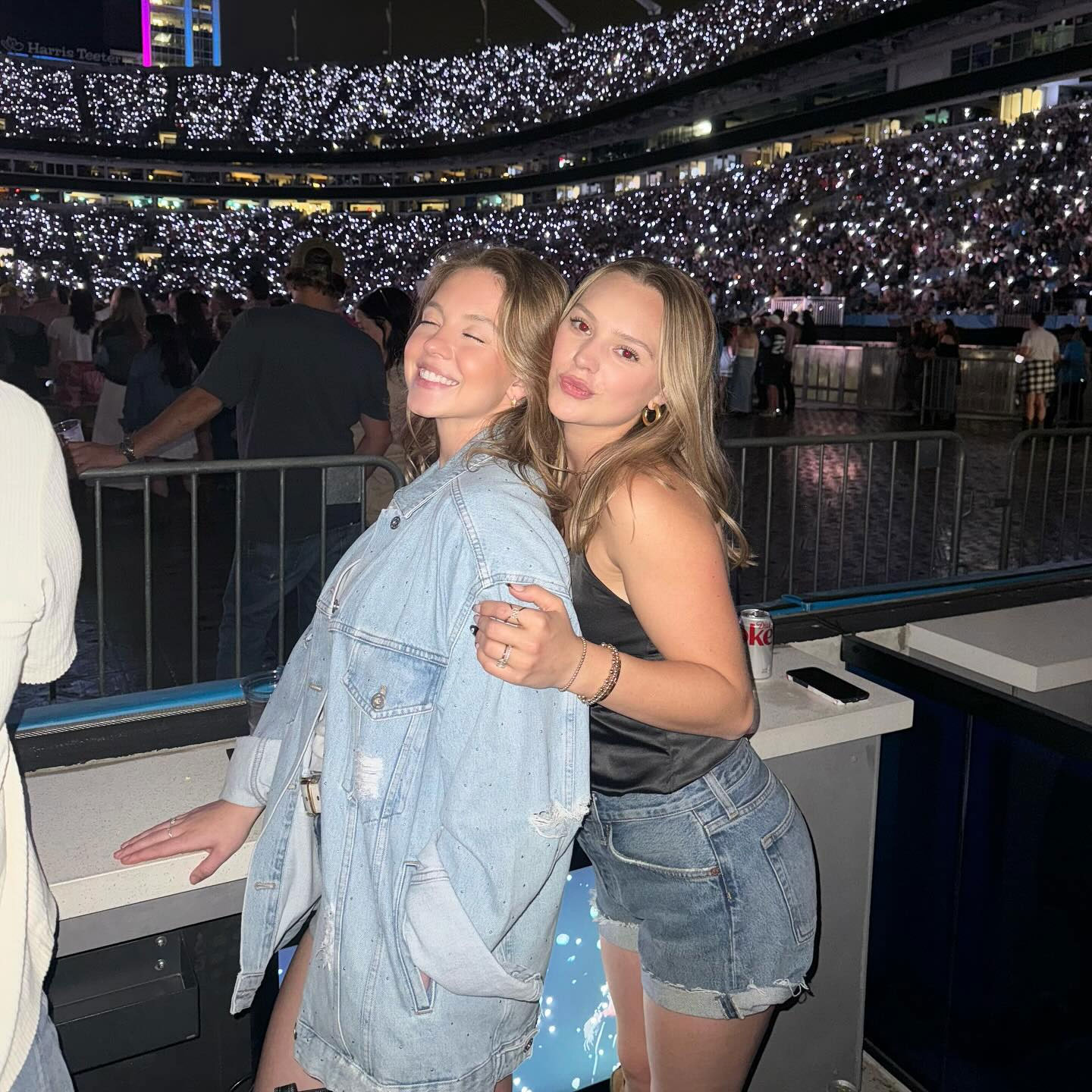 Sydney Sweeney oversized denim jacket cowboy boots Luke Combs concert