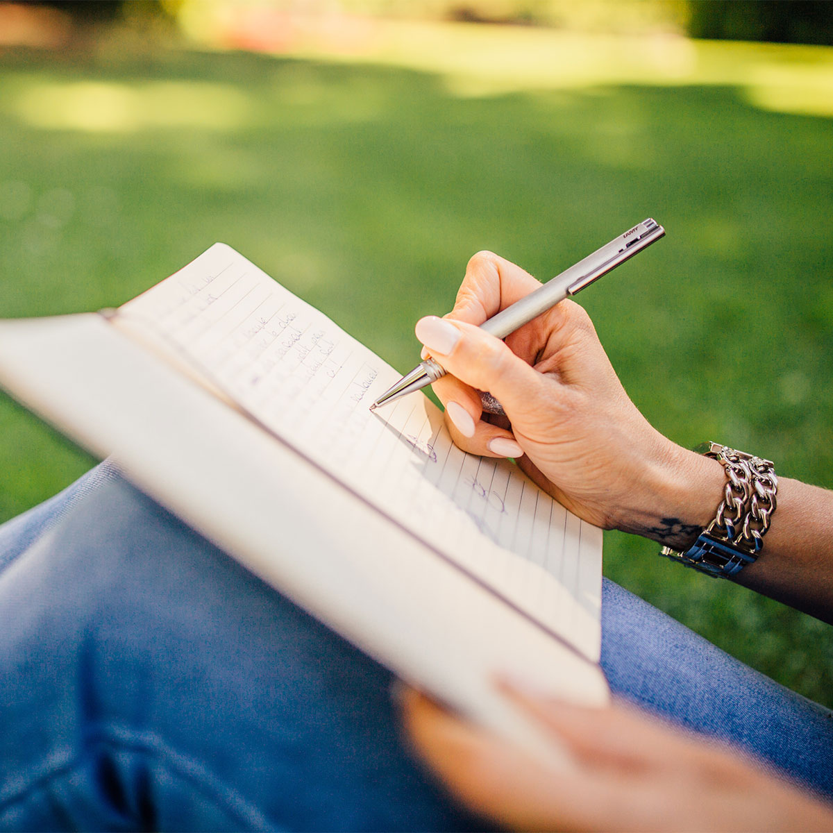 woman journaling outside