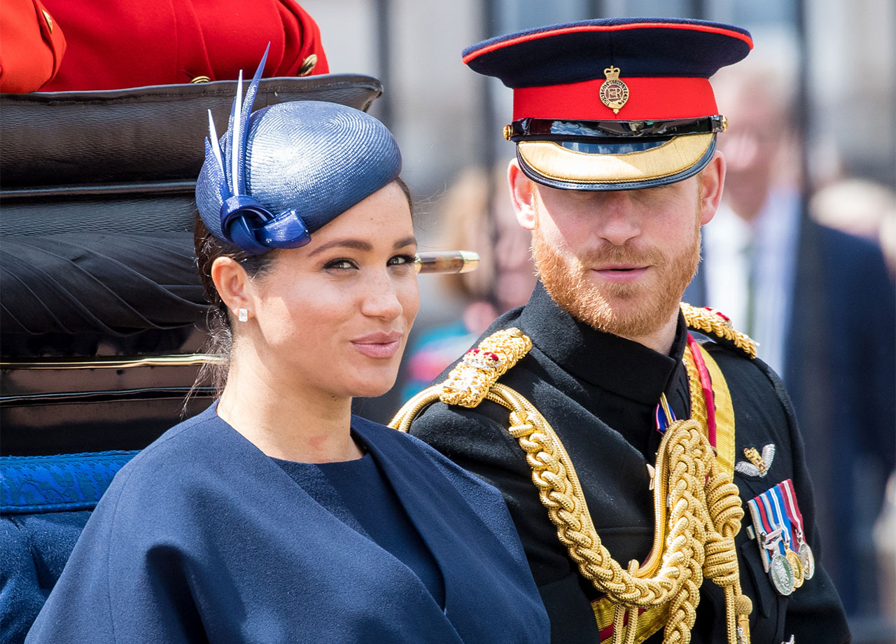 Prince Harry and Meghan Markle in a carriage