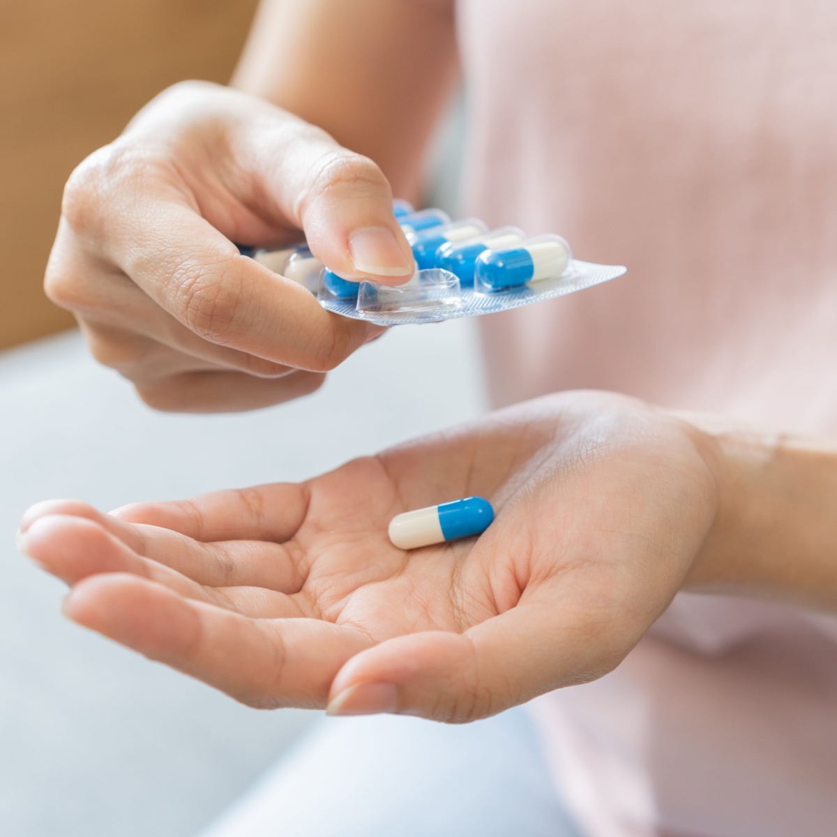 woman taking antibiotics