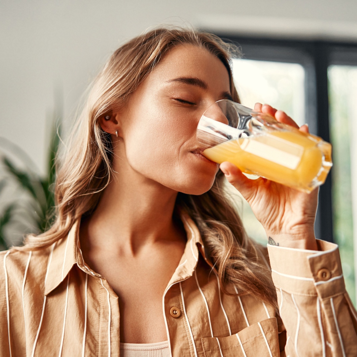 woman drinking fruit juice