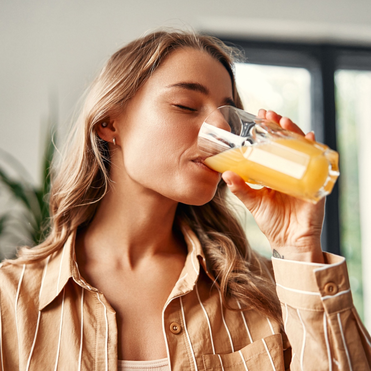 woman drinking juice