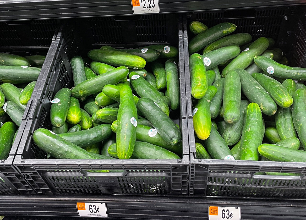 cucumbers on shelves at walmart produce section