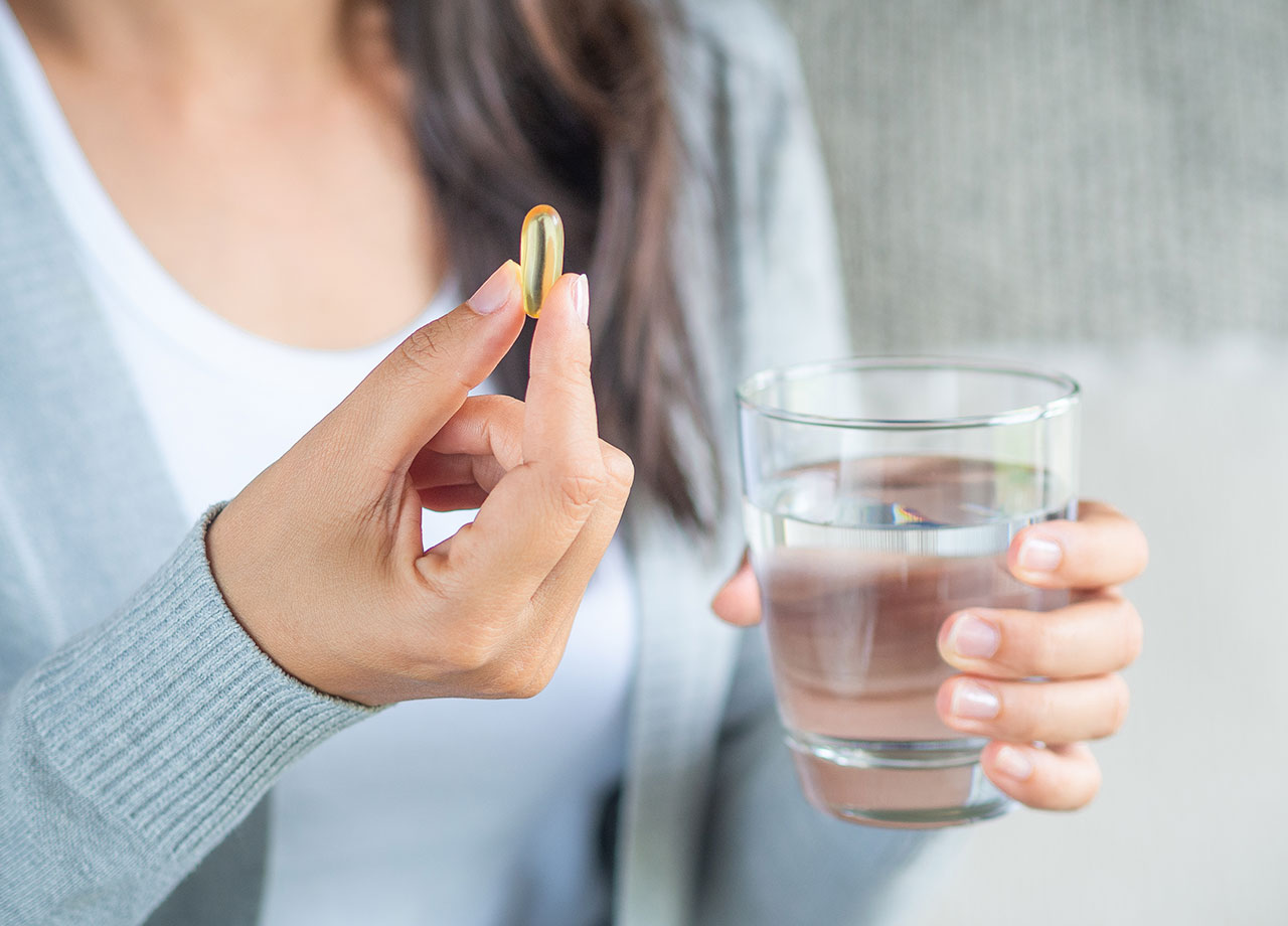 woman-taking-supplement