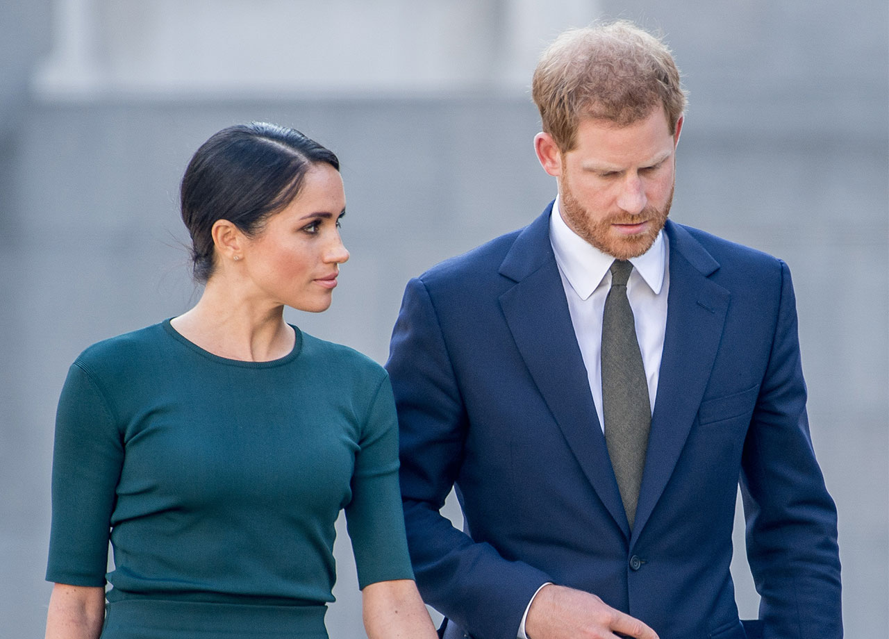 Prince Harry and Meghan Markle look downcast