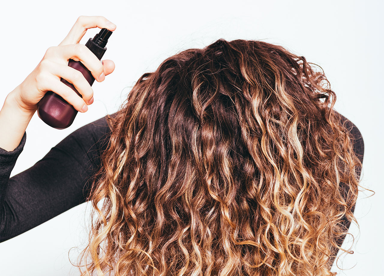 woman-using-root-lifting-spray