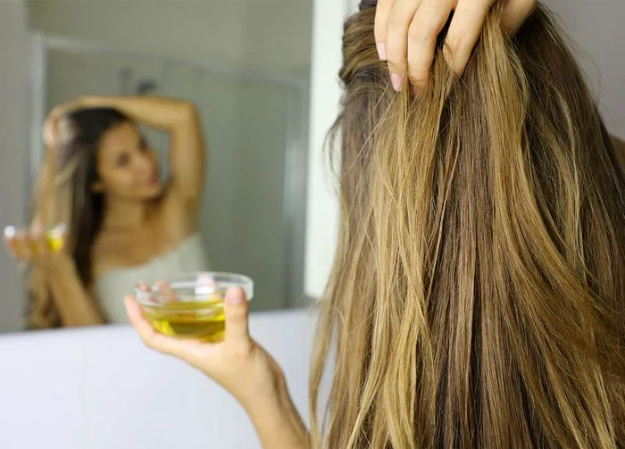 woman-using-olive-oil-hair