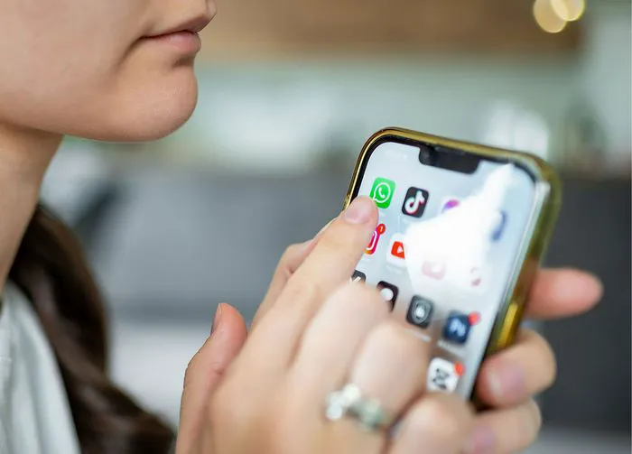 woman-using-phone-while-charging