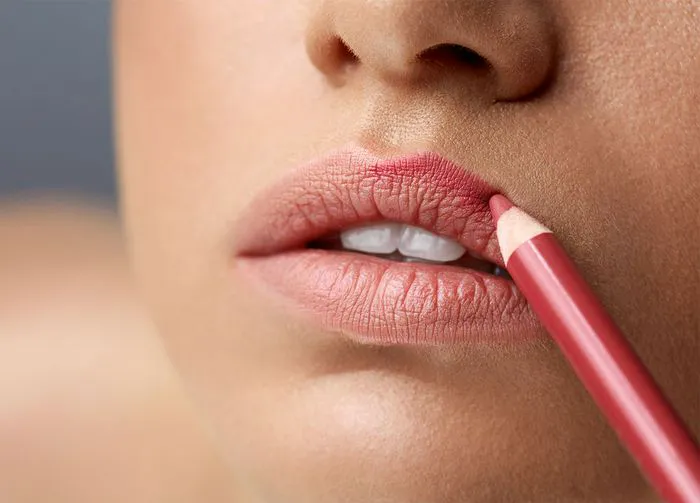 applying-pink-lip-liner
