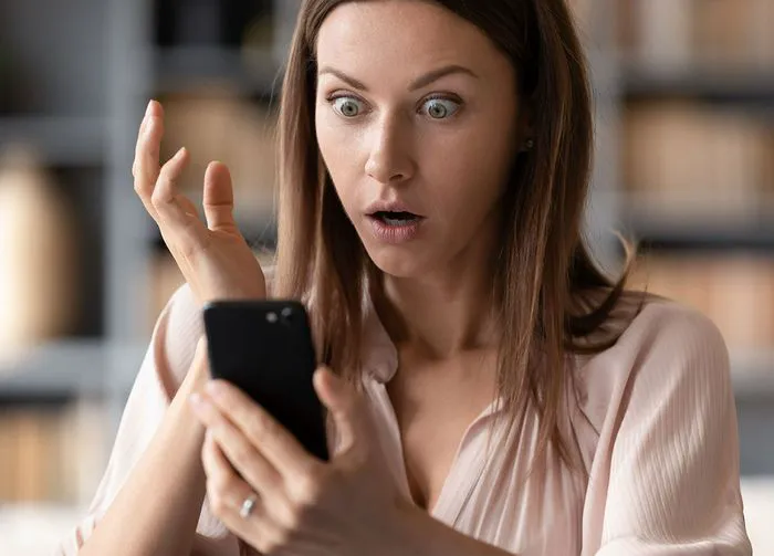 woman-shocked-phone-hacked