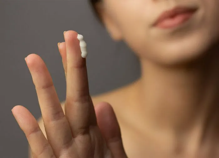 woman-applying-cream